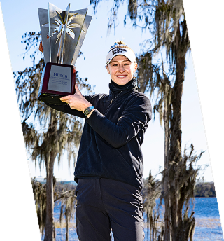 woman holding trophy