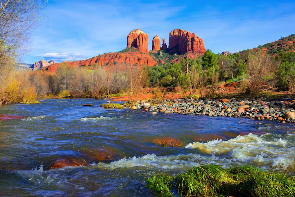Red buttes along the blue horizon in Arizona.