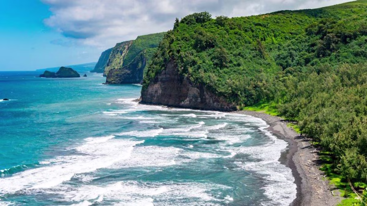 Stunning aerial images, lush green cliffs, turquoise waves crashing, Big Island, Hawaii.