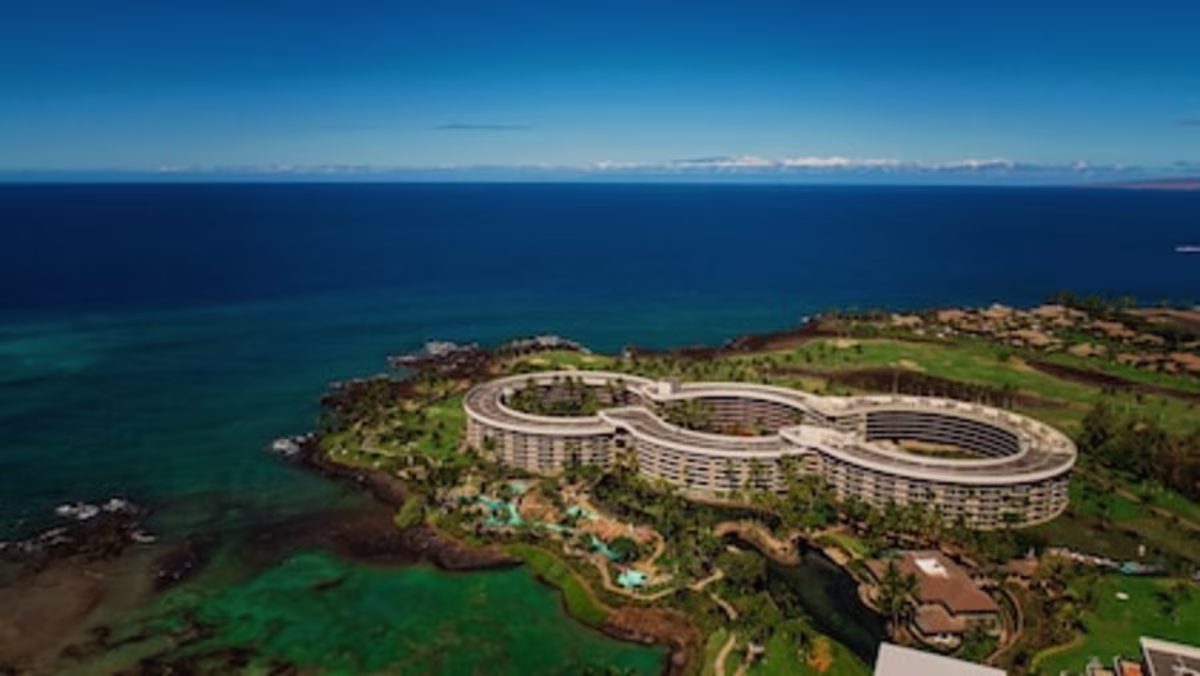 Stunning aerial shot of the coastline and sprawling grounds of Ocean Tower, a Hilton Grand Vacations Club, Waikoloa, Hawaii