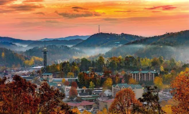 Sunrise over the Gatlinburg, Tennessee, skyline and the Smoky Mountains in fall