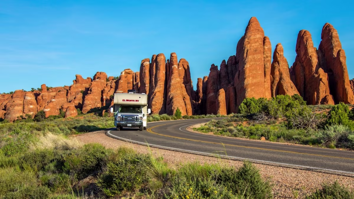 El Monte RV driving through Red Rocks, Utah.