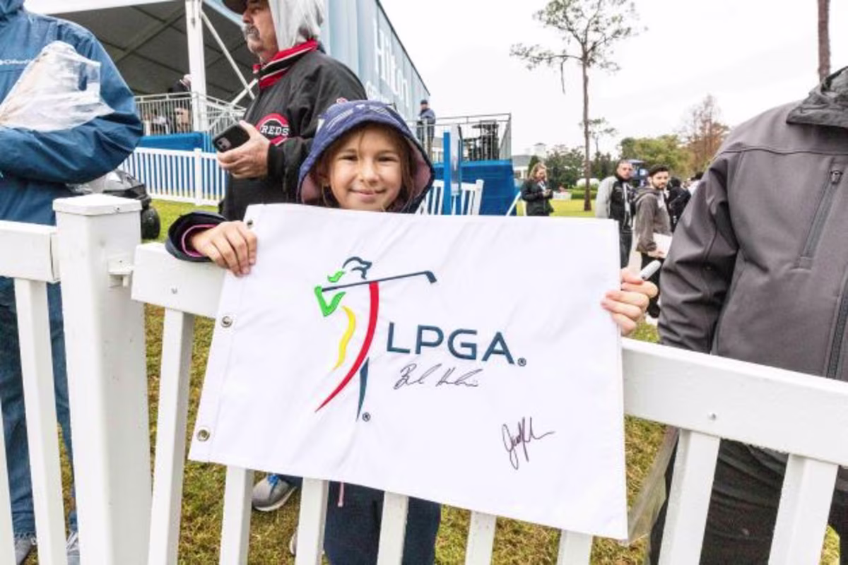 Little girl holding sign at Hilton Grand Vacations Tournament of Champions, Lake Nona Golf & Country Club, Orlando, Florida.