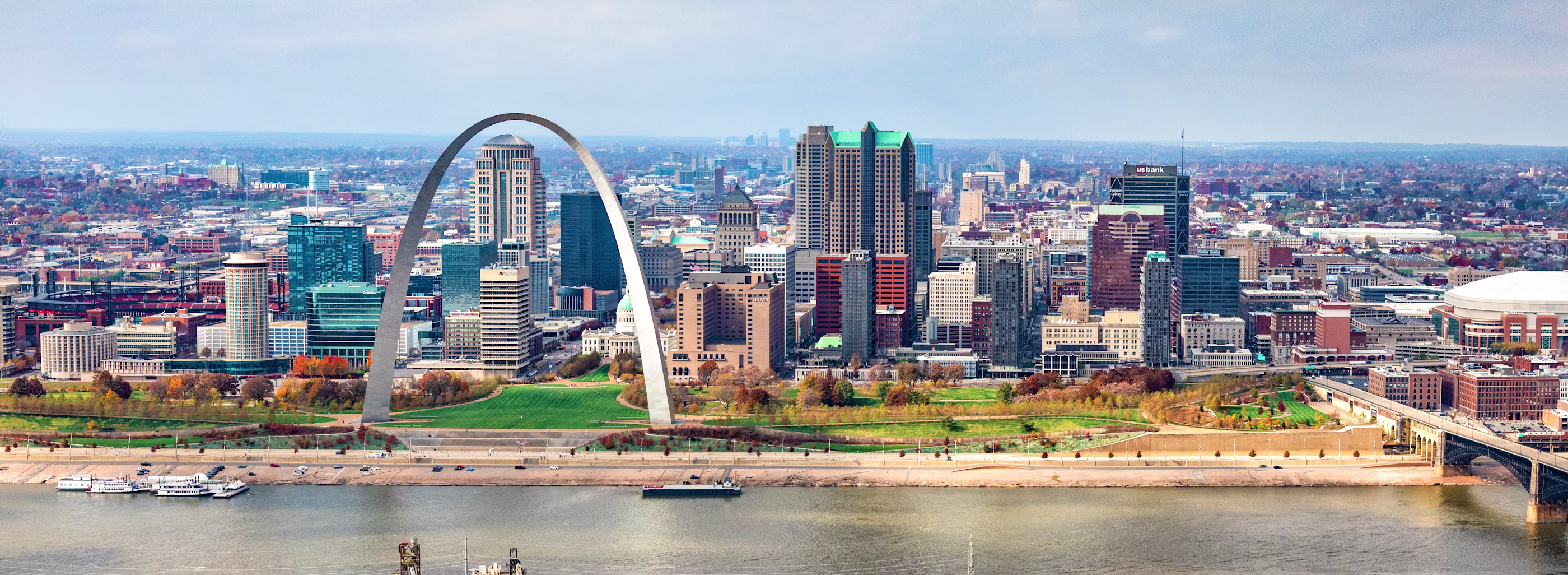 St. Louis cityscape in bright daylight, featuring its iconic arch.