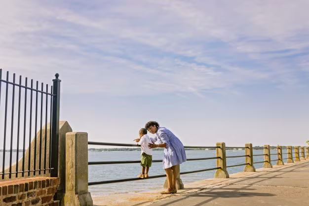 Woman showing young child the harbor, The Battery, Charleston, South Carolina. 