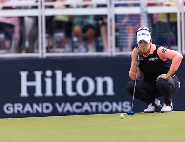 Golfer looking at ball before a putt