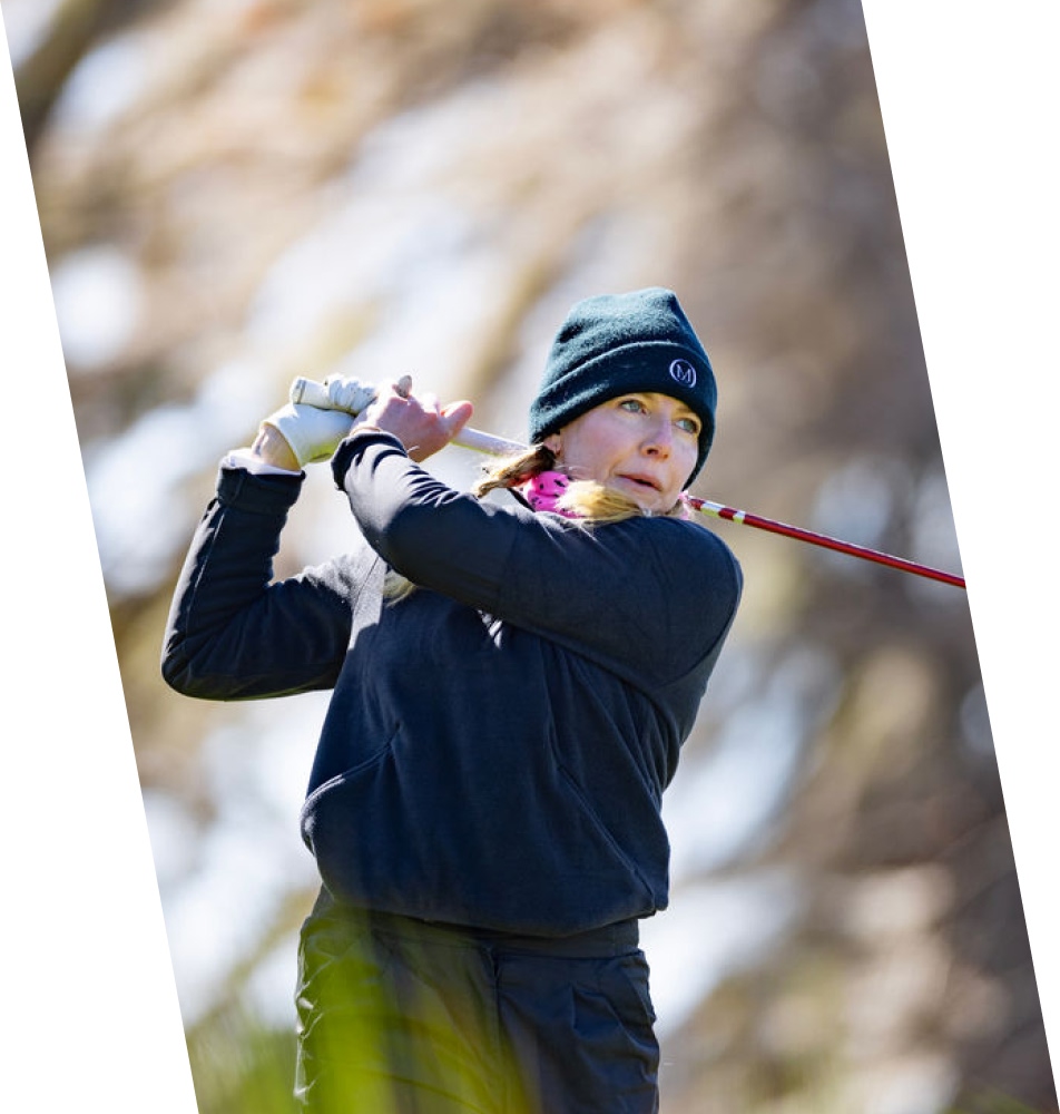 Close up of female pro golfer face after swining club