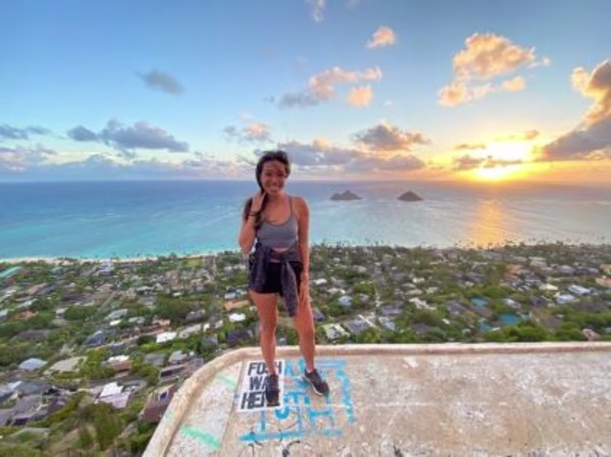 A Hilton Grand Vacations Member on China Walls in Oahu, Hawaii, at sunset