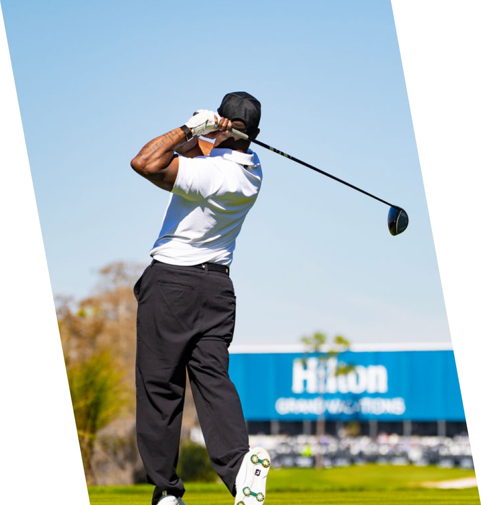 man swinging golf club