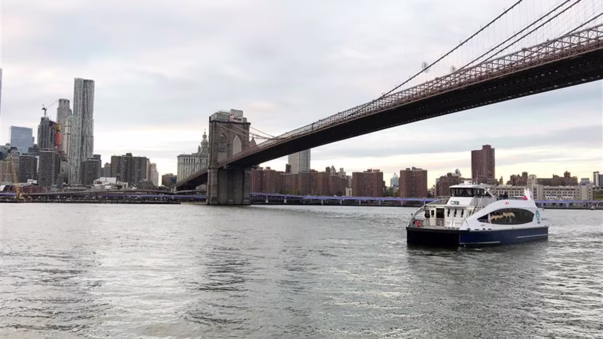 Small Boat on a bay with city skyline