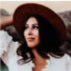 A headshot of Rashida, a Hilton Grand Vacations Member