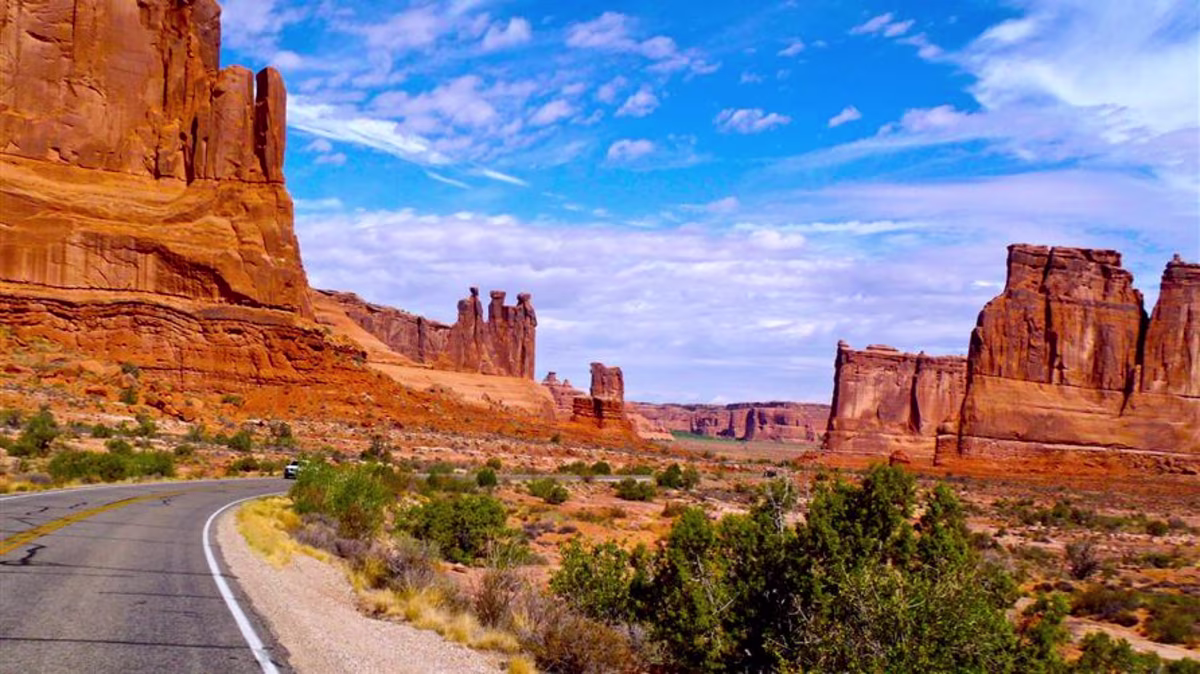 A picture of the open road in Arches National Park, Utah on a Utah National Parks road trip.