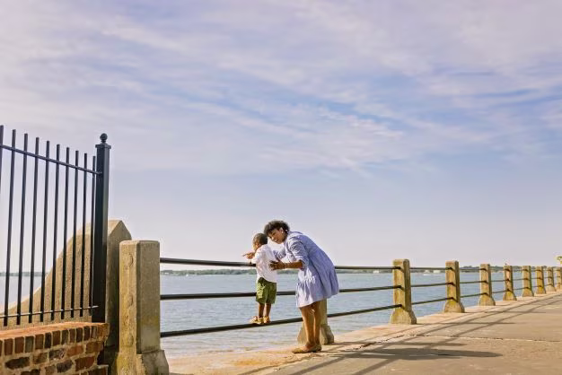 Woman showing young child the harbor, The Battery, Charleston, South Carolina. 