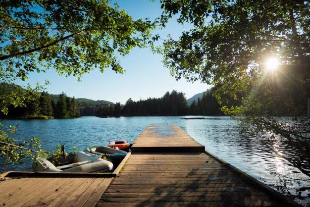 Dock with kayaks at Alpha Lake near Whistler, Canada, in summer