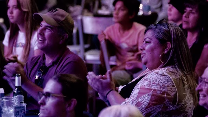 Hilton Grand Vacations Owners, smiling, clapping, HGV Ultimate Access HGV Live! show. 