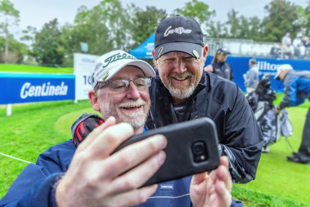 Fan snapping selfie with celebrity, Hilton Grand Vacations Tournament of Champions, Orlando, Florida. 